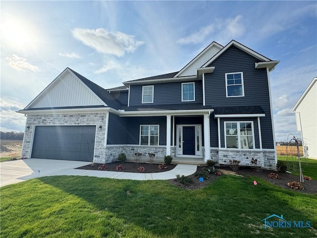 craftsman inspired home featuring a garage, covered porch, and a front yard