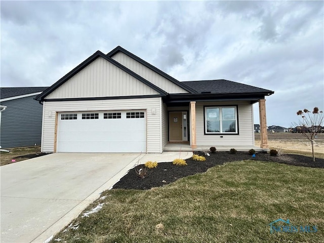 view of front of house with a garage and a front yard