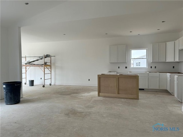 kitchen featuring white cabinets