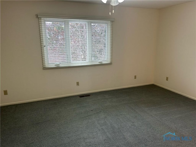 carpeted empty room with ceiling fan