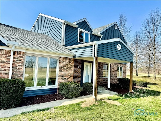 view of front of home with a front yard