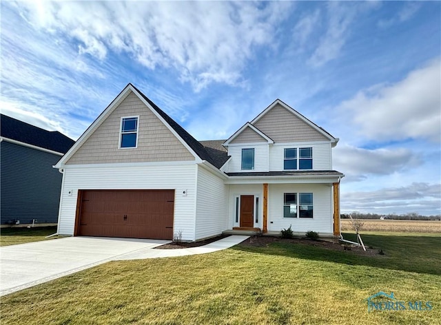 view of front of house featuring a garage and a front yard