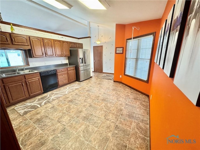 kitchen featuring sink, decorative light fixtures, stainless steel fridge with ice dispenser, black dishwasher, and lofted ceiling