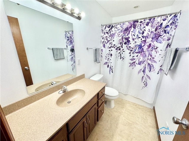 full bathroom with vanity, toilet, and shower / bath combo with shower curtain