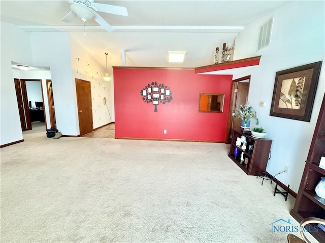 interior space with ceiling fan, beamed ceiling, and high vaulted ceiling