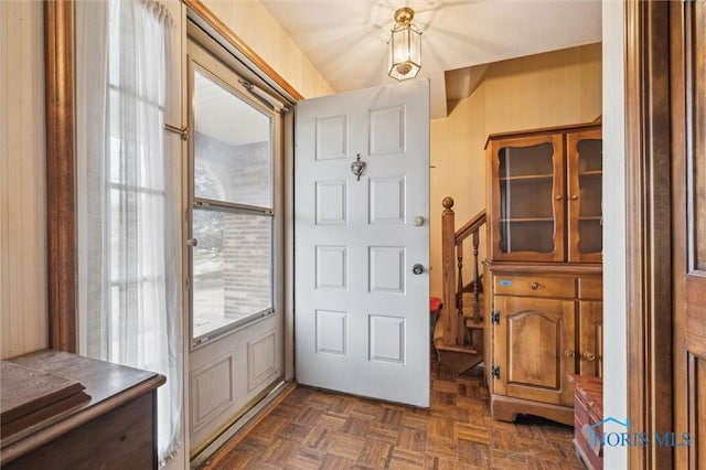 entrance foyer featuring dark parquet floors