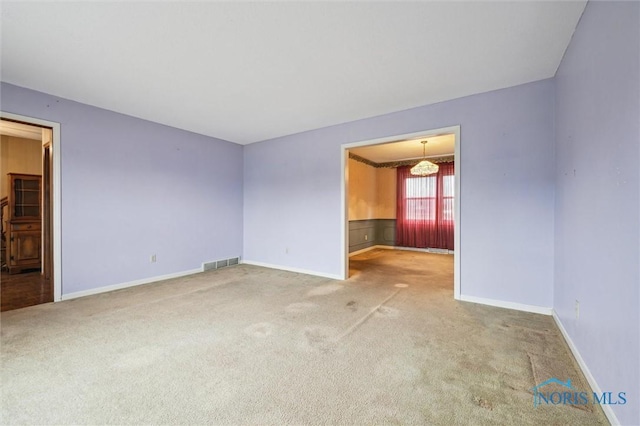 unfurnished room with carpet