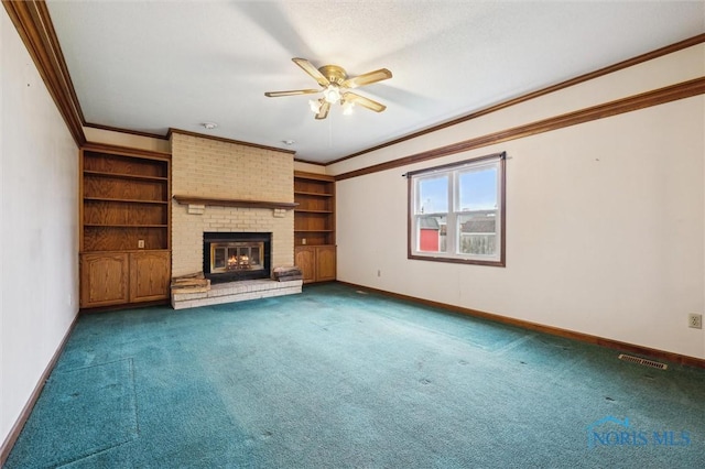 unfurnished living room featuring ceiling fan, crown molding, carpet floors, and a brick fireplace