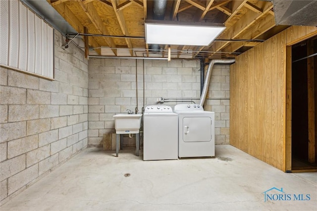 washroom with independent washer and dryer and sink