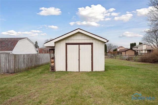 view of outdoor structure with a yard