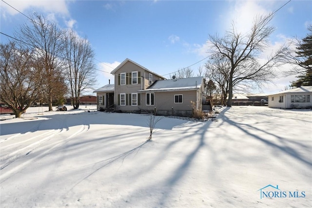 view of snow covered property