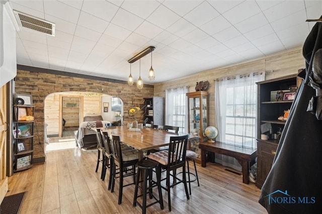 dining space with light hardwood / wood-style flooring