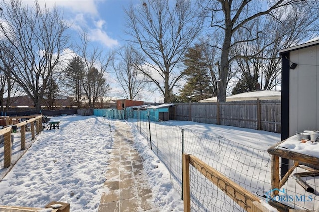 view of yard covered in snow