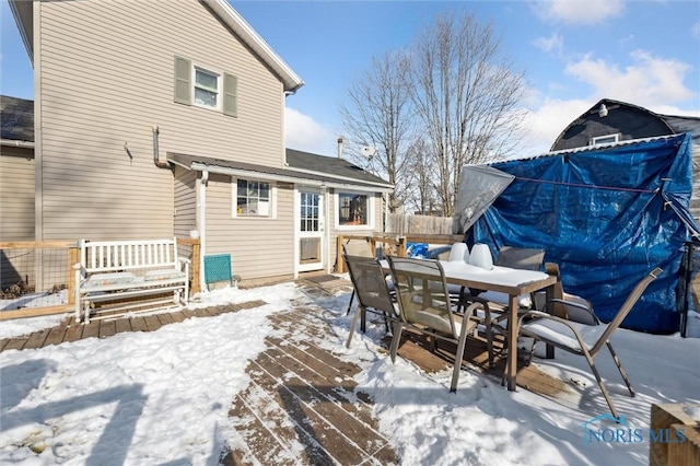 view of snow covered deck