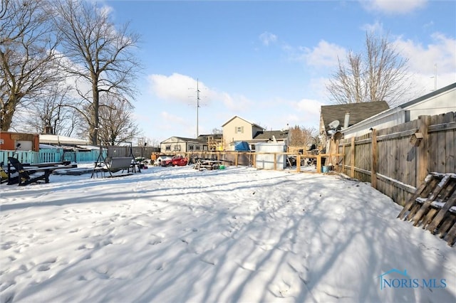 view of yard layered in snow