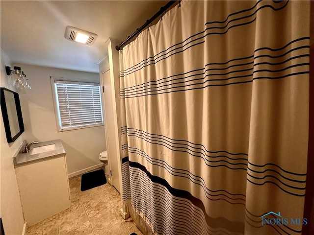 bathroom with vanity and toilet