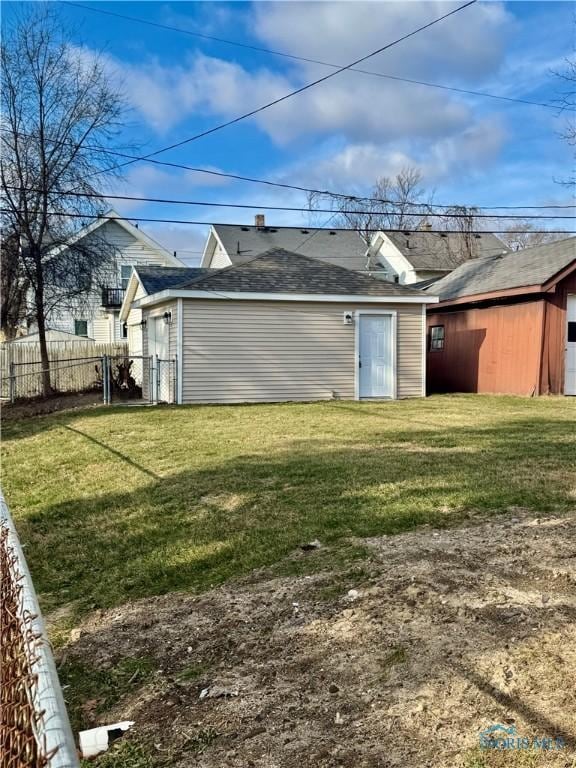 rear view of house with a lawn