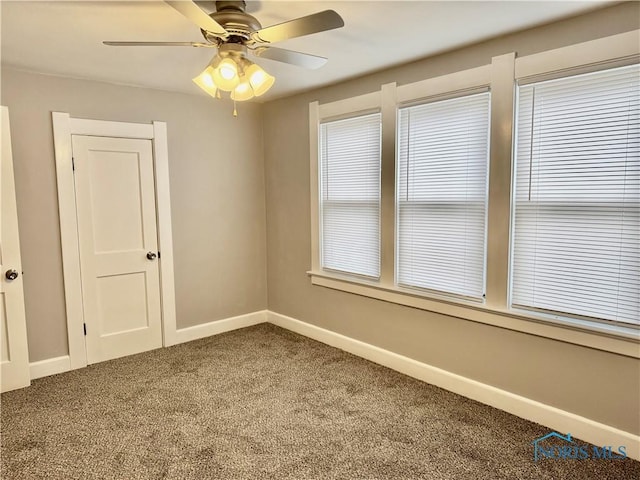 unfurnished room with ceiling fan, carpet, and plenty of natural light