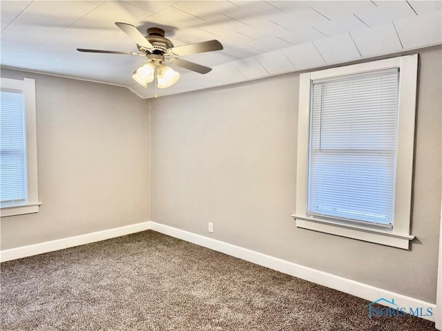 carpeted empty room featuring ceiling fan