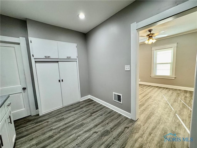 washroom with ceiling fan and light hardwood / wood-style floors