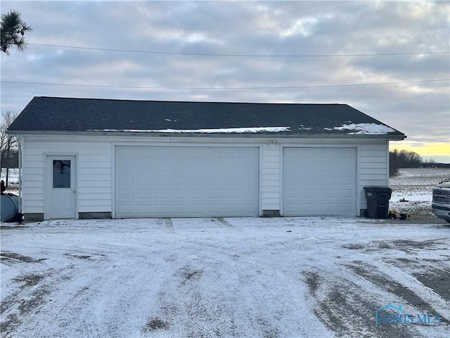 view of snow covered garage