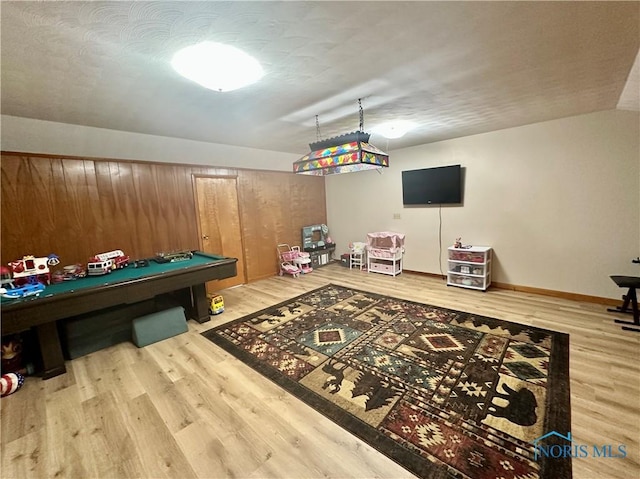 game room with hardwood / wood-style flooring and pool table