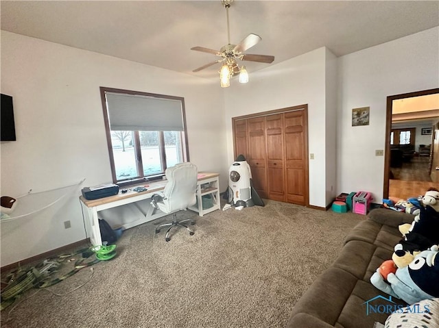 carpeted office space with ceiling fan