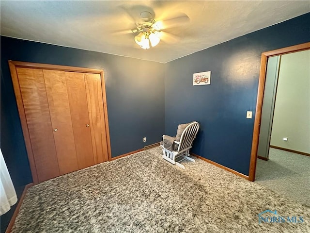 unfurnished bedroom with ceiling fan and carpet