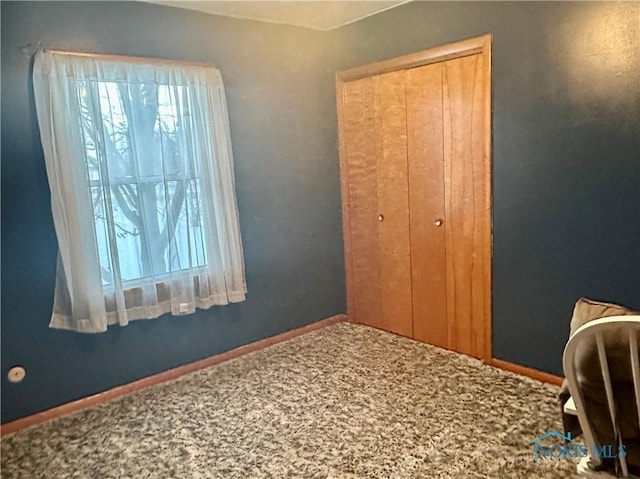 bedroom with a closet and carpet floors