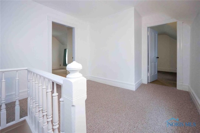 hallway with carpet flooring