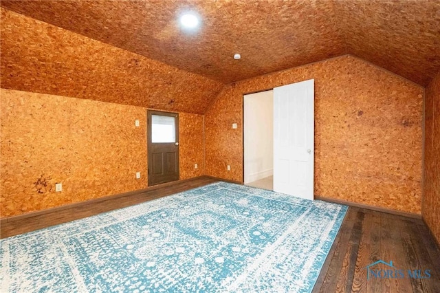 bonus room featuring hardwood / wood-style floors and lofted ceiling