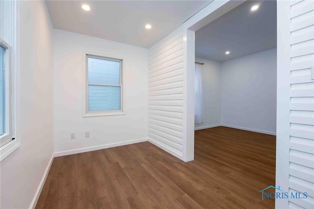 spare room featuring dark hardwood / wood-style flooring