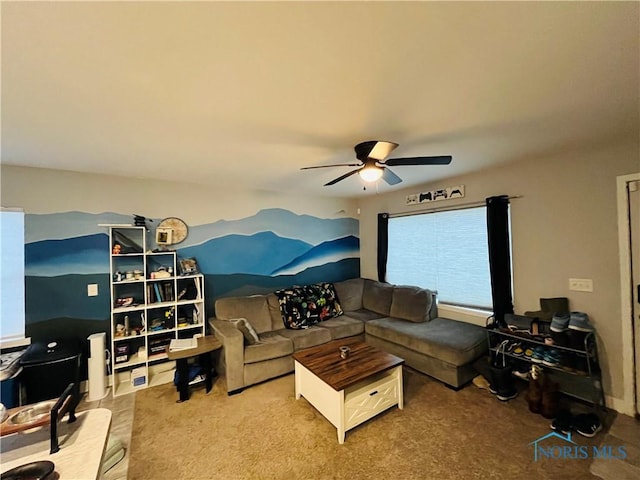 carpeted living room with ceiling fan