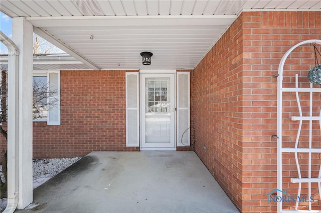 property entrance featuring a patio