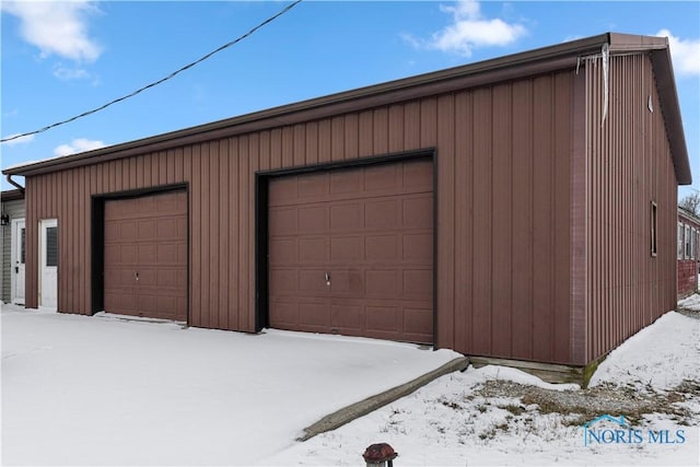 view of snow covered garage