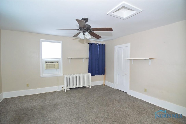 carpeted empty room with ceiling fan, cooling unit, and radiator