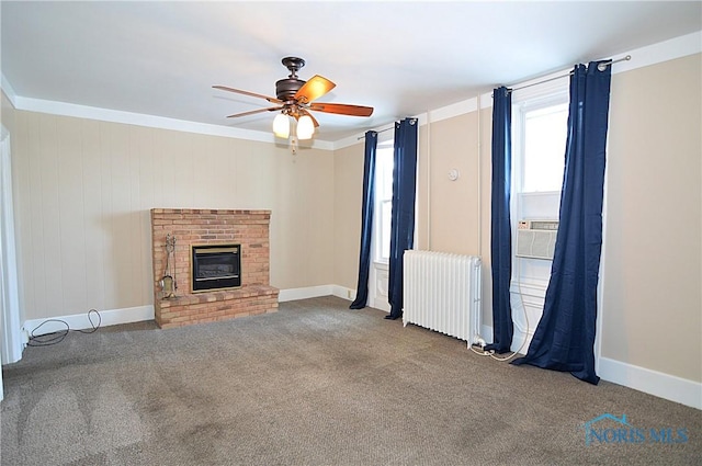 unfurnished living room featuring radiator heating unit, cooling unit, ceiling fan, carpet floors, and a fireplace