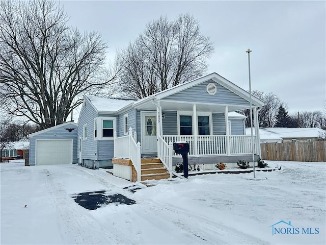 view of front of home with an outdoor structure and a garage