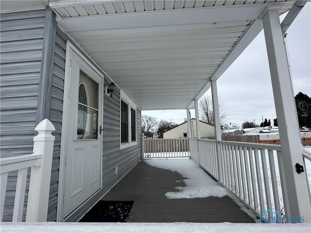 view of snow covered deck