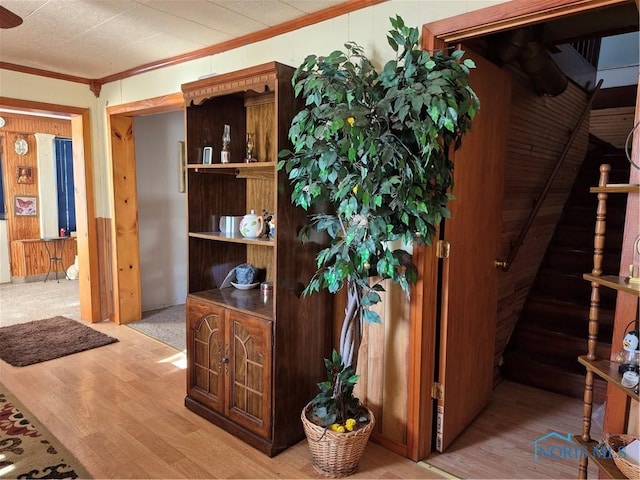 interior space featuring hardwood / wood-style flooring and ornamental molding