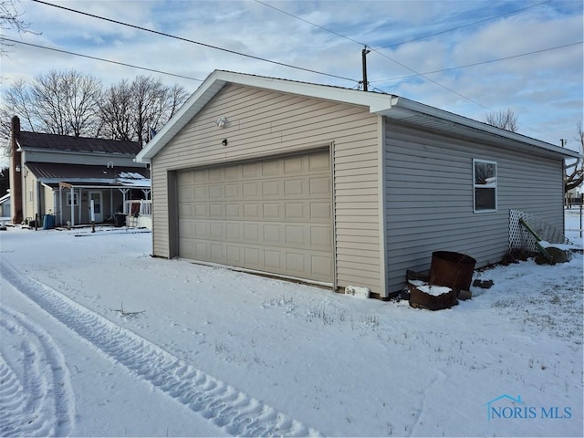 view of snow covered garage