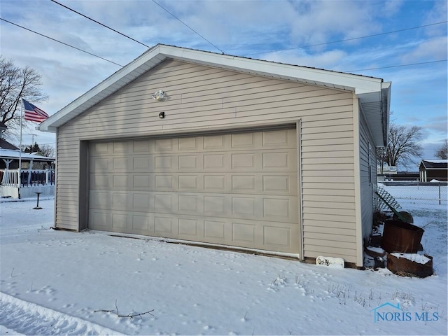 view of snow covered garage