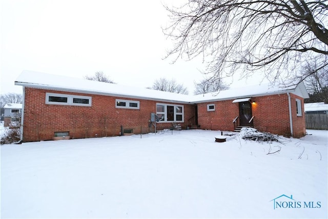 view of snow covered house