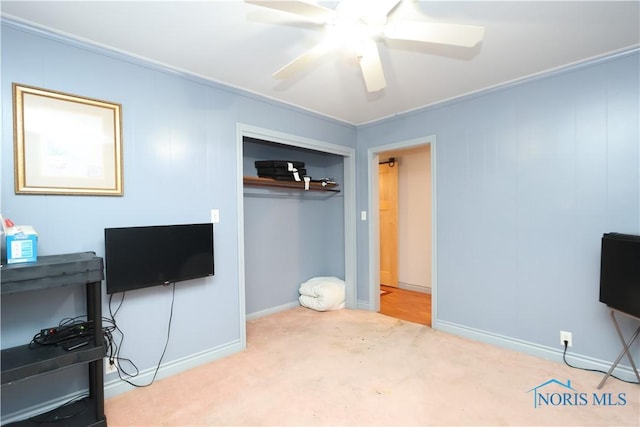 bedroom featuring light colored carpet and ceiling fan