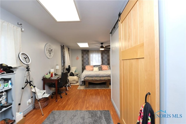 bedroom with hardwood / wood-style flooring