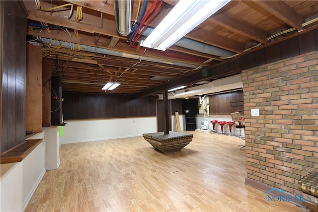 basement featuring light wood-type flooring