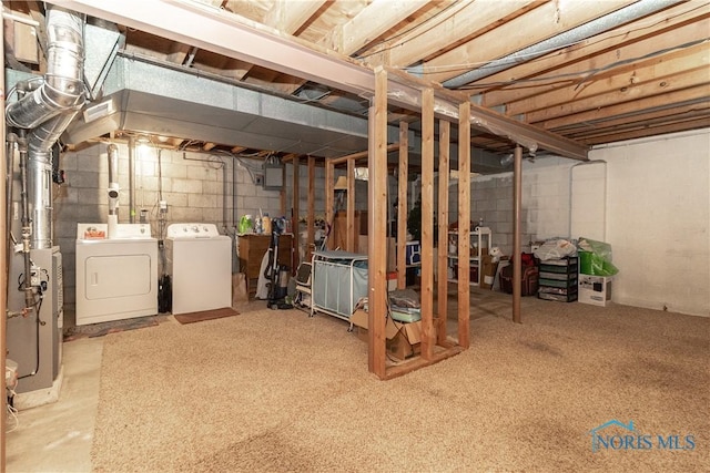 basement with washer and clothes dryer