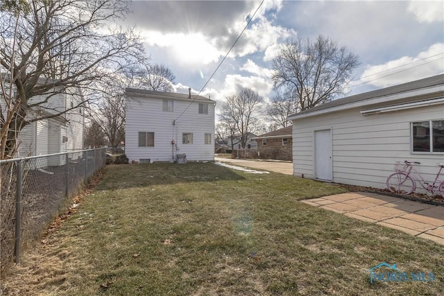 rear view of property featuring a lawn