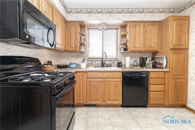 kitchen featuring sink and black appliances