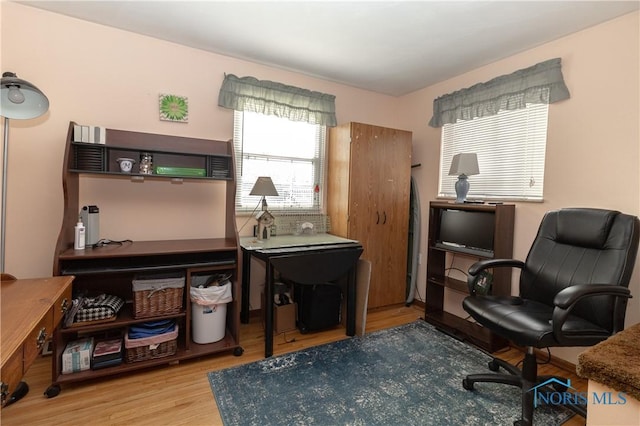 office area with hardwood / wood-style floors